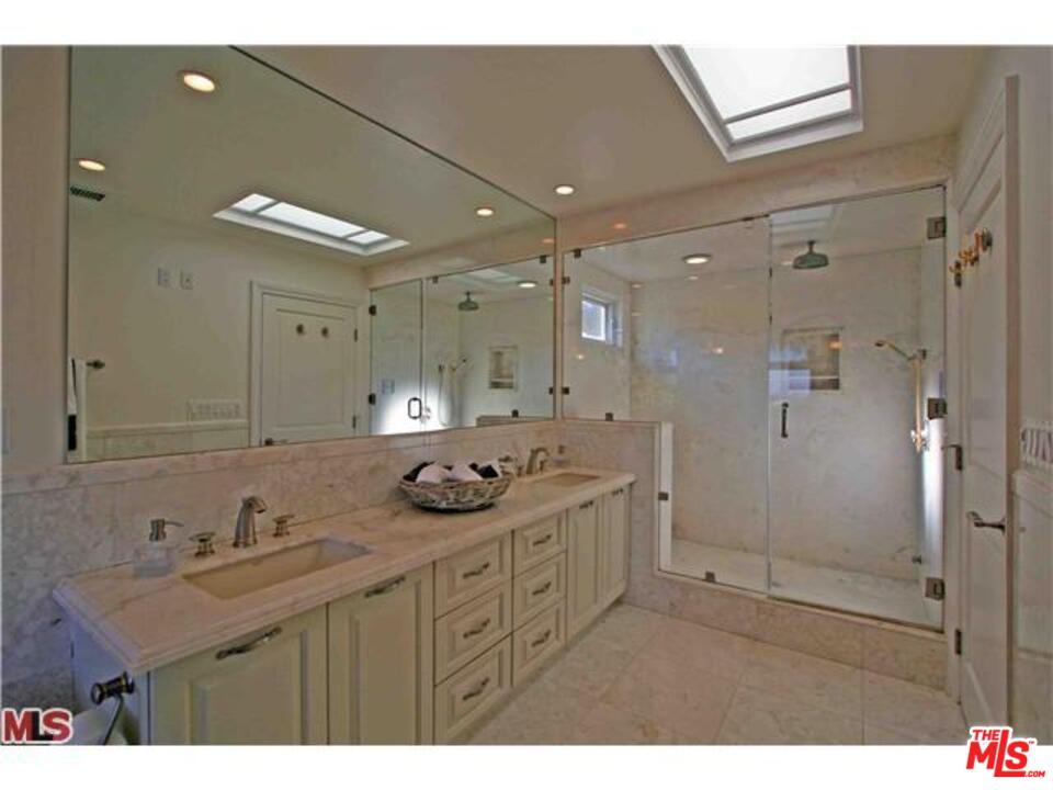 1148 Las Pulgas Road Pacific Palisades, CA 90272 - Photo 8 of 13 a bathroom with a double vanity sink mirror and shower