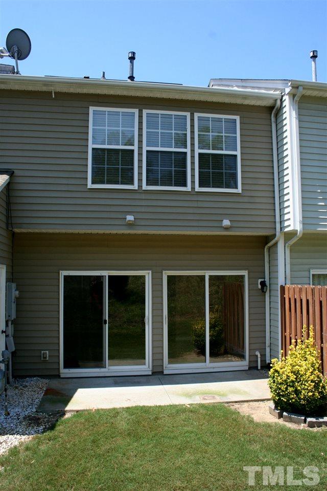 5025 Echo Ridge Road Raleigh, NC 27612 - Photo 11 of 18 a front view of a house with a yard