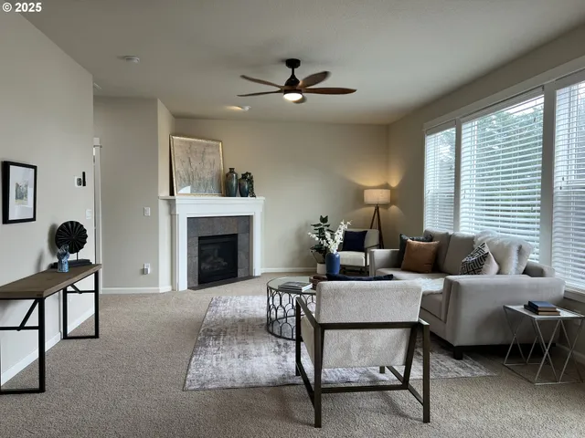 a living room with furniture and a fireplace