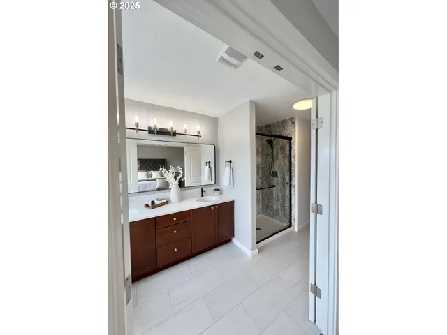 a large bathroom with a sink and a mirror