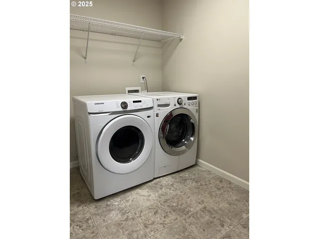 a utility room with dryer and washer