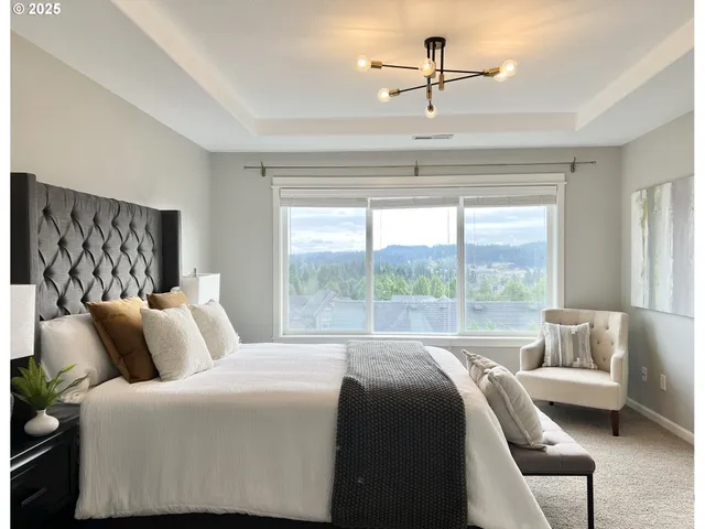 a bedroom with a large bed and a couch