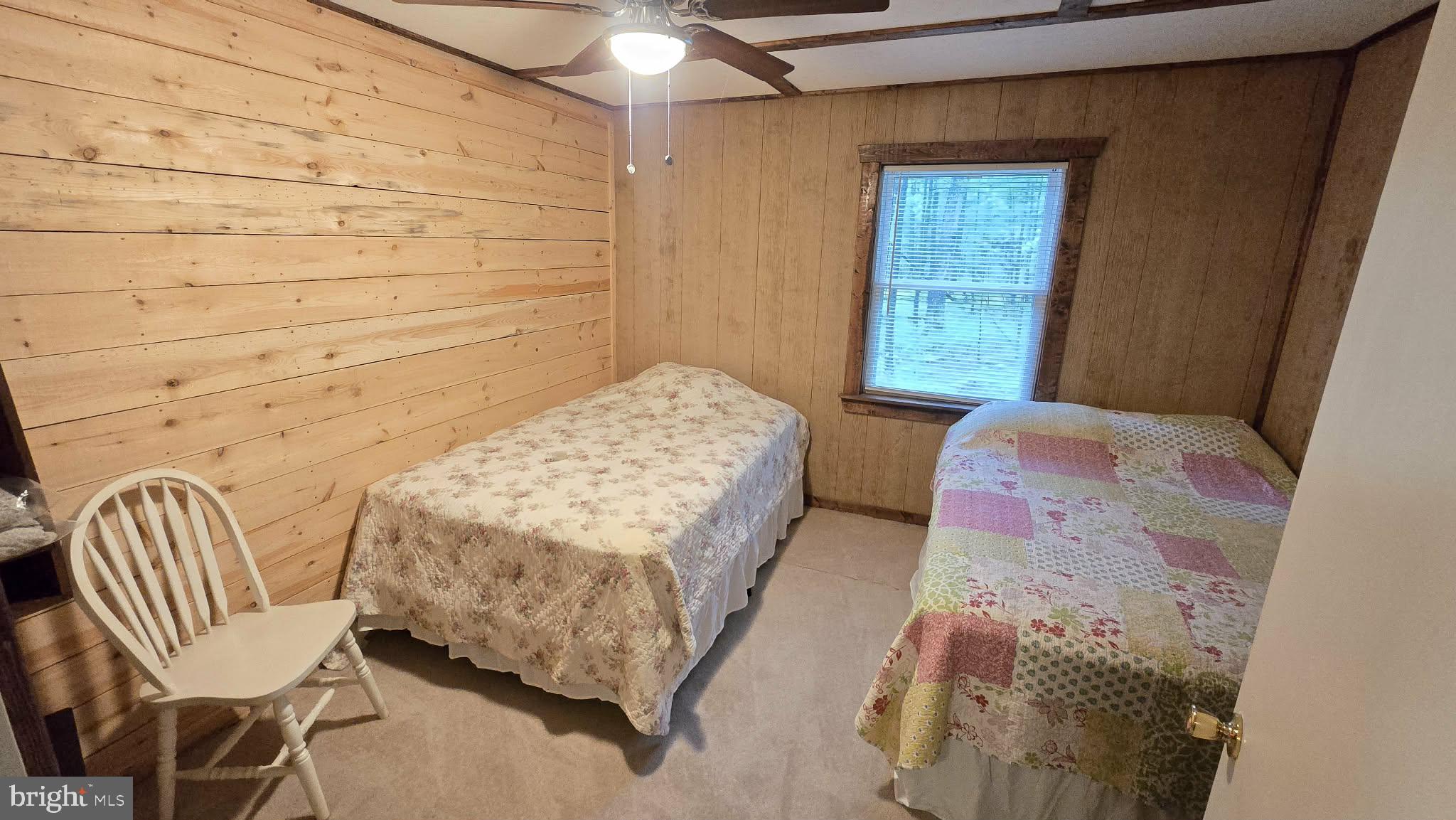 8245 Aughwick Road Fort Loudon, PA 17224 - Photo 13 of 26 a bedroom with a bed chair and wall