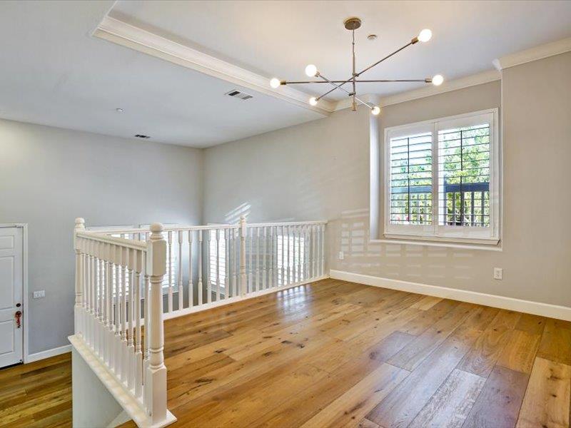 6130 Yardley Lane San Ramon, CA 94582 - Photo 12 of 46 a view of an empty room with wooden floor and fan