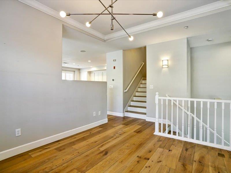 6130 Yardley Lane San Ramon, CA 94582 - Photo 13 of 46 a view of a hallway with wooden floor and staircase