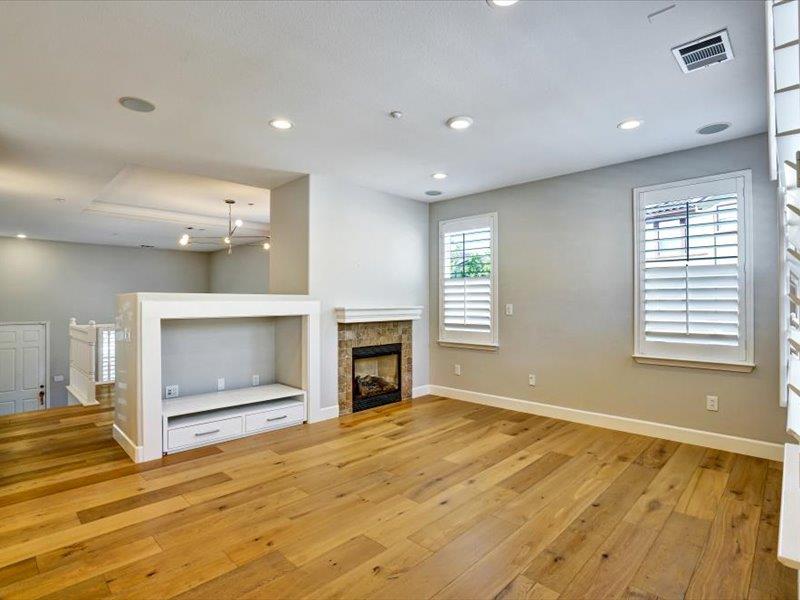 6130 Yardley Lane San Ramon, CA 94582 - Photo 17 of 46 a view of an empty room with a fireplace and a window