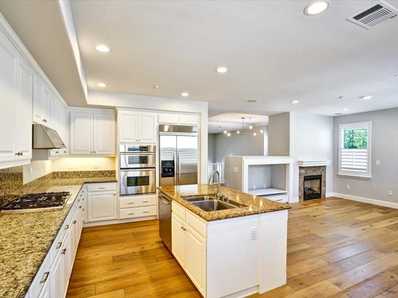 6130 Yardley Lane San Ramon, CA 94582 - Photo 2 of 46 a large kitchen with stainless steel appliances kitchen island granite countertop a large counter top and stove