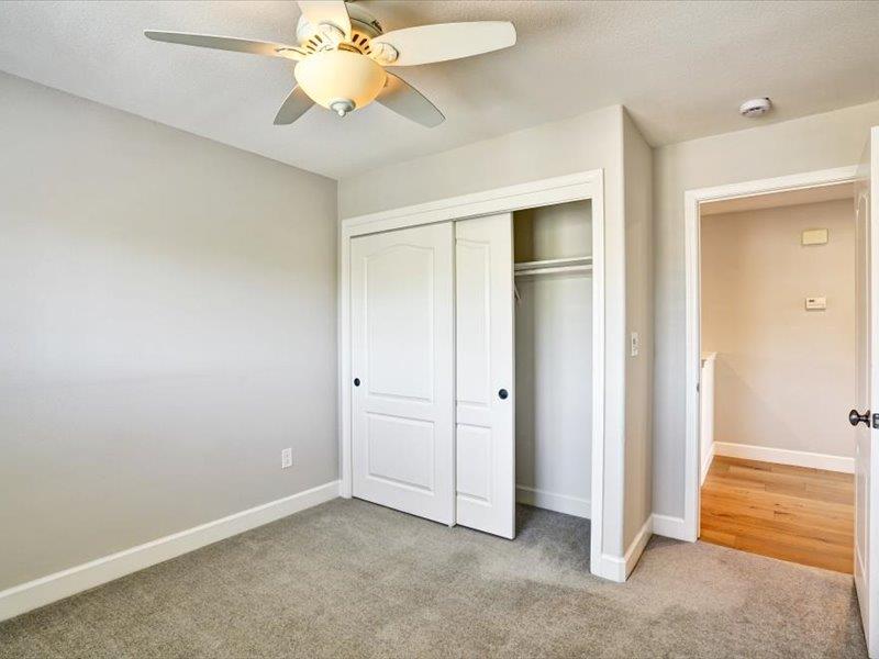 6130 Yardley Lane San Ramon, CA 94582 - Photo 24 of 46 an empty room with closet and a chandelier fan