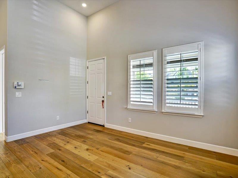6130 Yardley Lane San Ramon, CA 94582 - Photo 9 of 46 a view of an empty room with wooden floor and a window