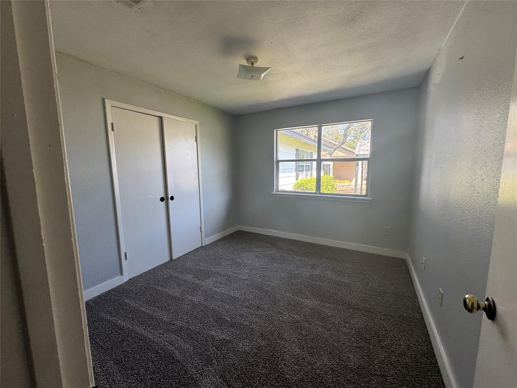 402 North Hughes Street Howe, TX 75459 - Photo 11 of 17 a view of empty room with windows