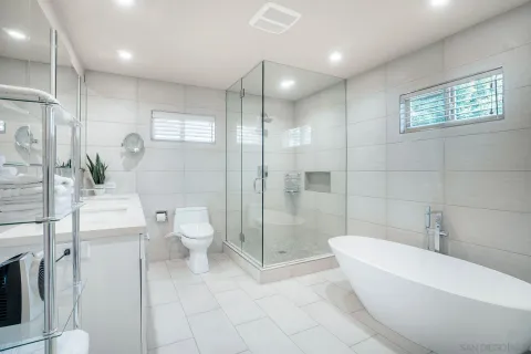 a bathroom with a toilet a sink and bathtub