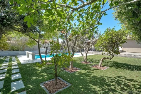 a view of a backyard with a sitting area
