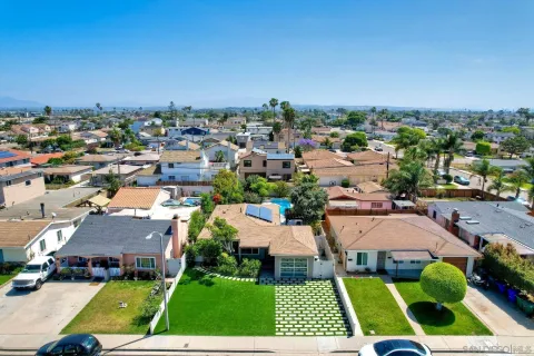 an aerial view of house with yard swimming pool and outdoor seating