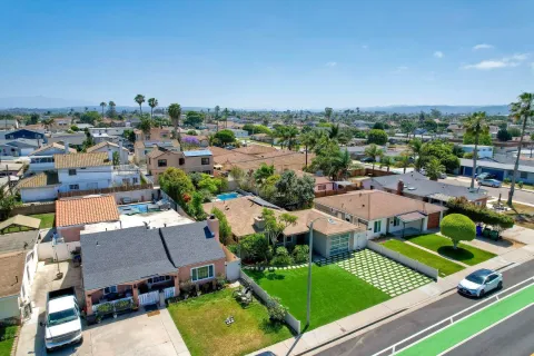an aerial view of residential houses with outdoor space