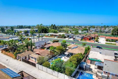 an aerial view of residential houses with outdoor space