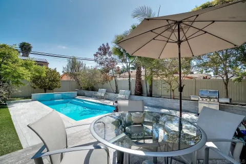 a patio with a patio table and chairs