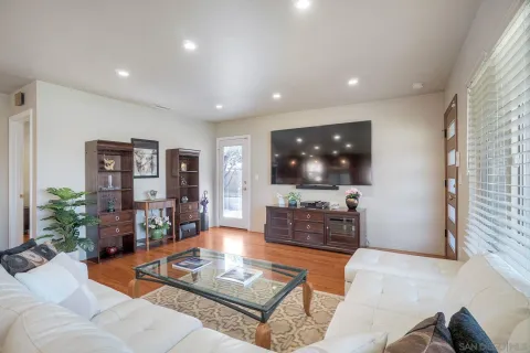 a living room with furniture and a flat screen tv