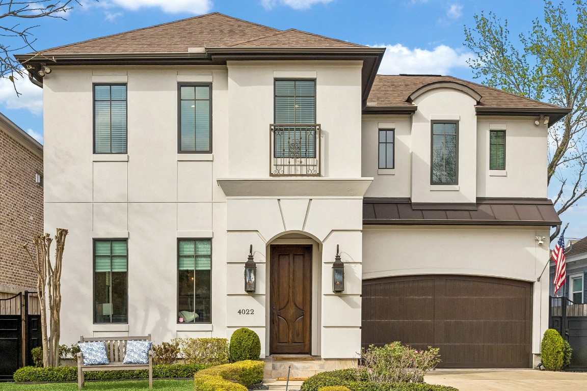 Welcome home to this elegant two-story stucco residence with timeless architectural details, featuring a welcoming arched entry, custom wood front door, Juliet balcony with wrought-iron railing, and manicured landscaping. The home’s refined façade, warm exterior lighting, and thoughtfully designed walkway create exceptional curb appeal in this desirable neighborhood.