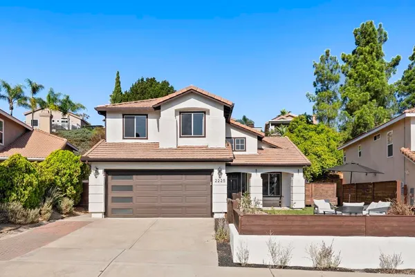 a front view of a house with a garage