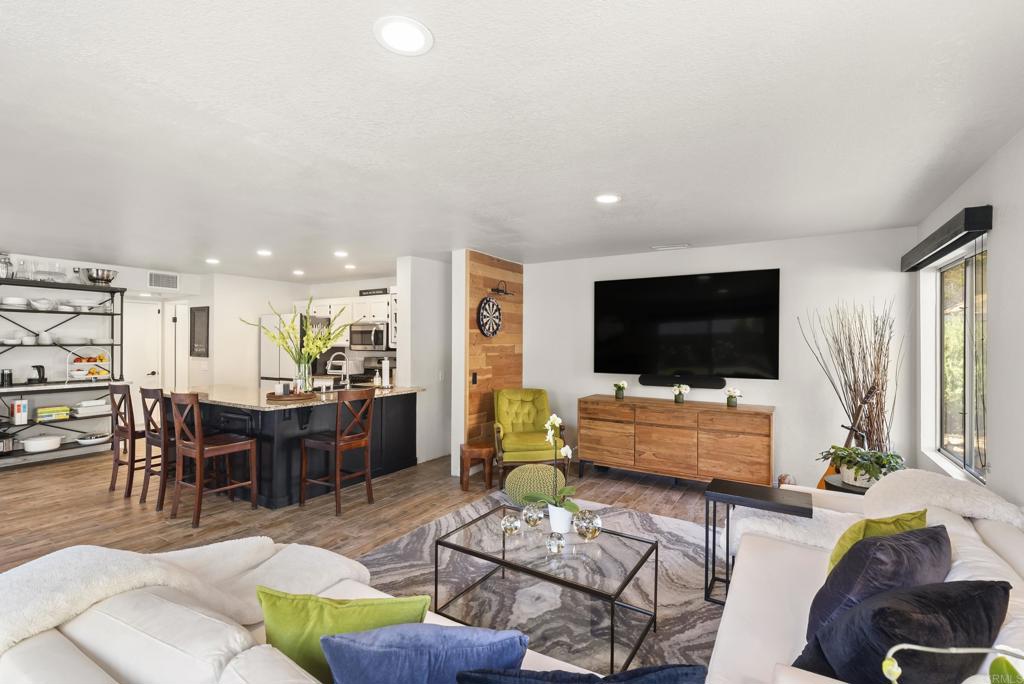 2225 Baxter Canyon Road Vista, CA 92081 - Photo 16 of 46 a living room with furniture and a flat screen tv