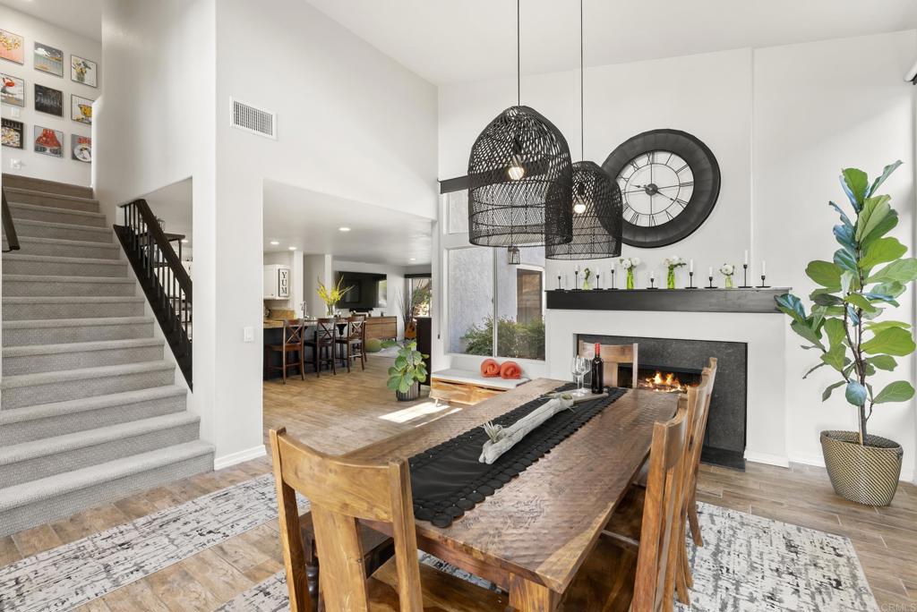 2225 Baxter Canyon Road Vista, CA 92081 - Photo 20 of 46 a view of a dining room with furniture and a clock