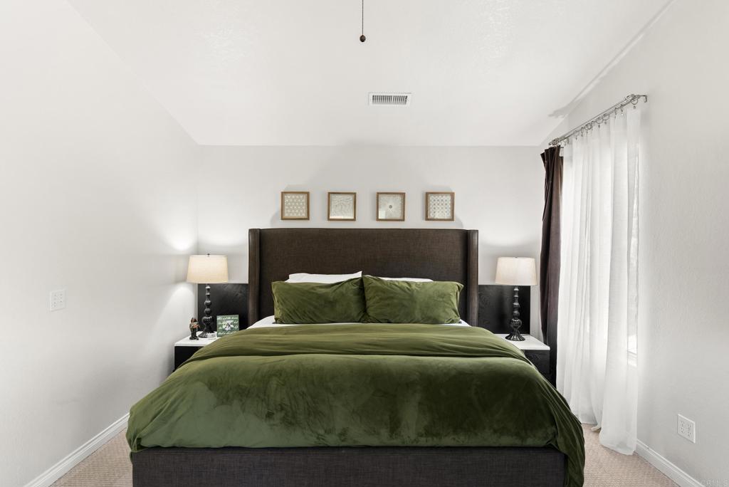 2225 Baxter Canyon Road Vista, CA 92081 - Photo 23 of 46 a bedroom with a bed and window