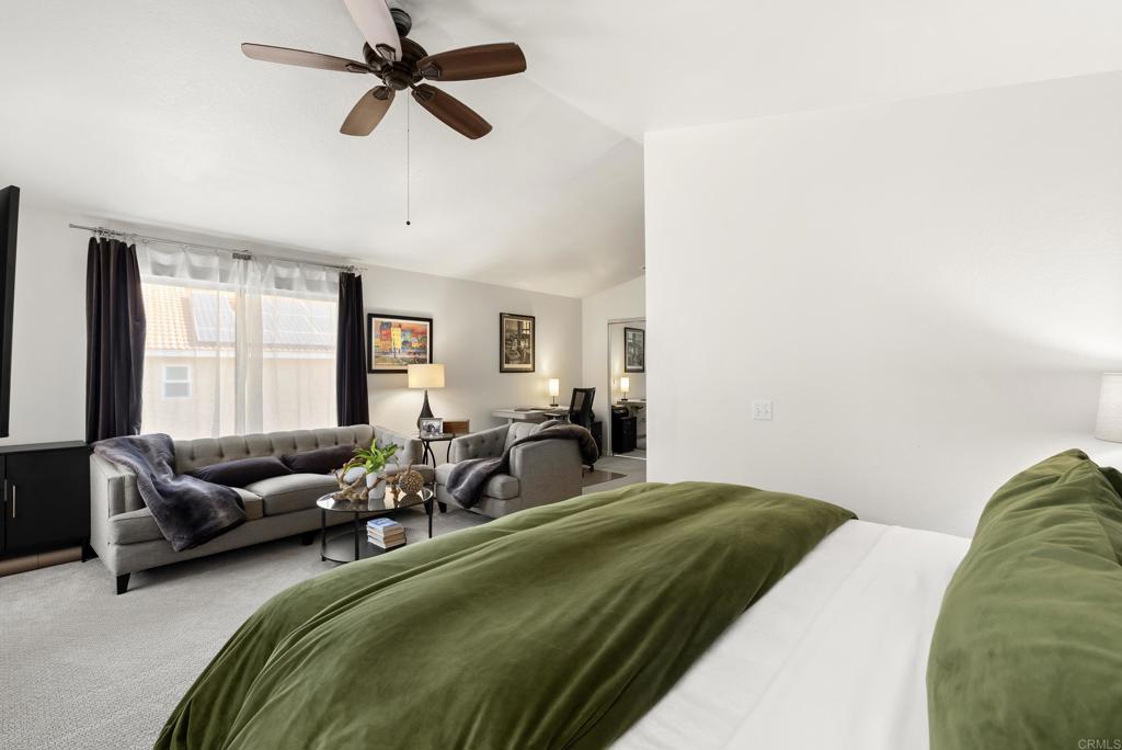 2225 Baxter Canyon Road Vista, CA 92081 - Photo 24 of 46 a bedroom with a bed couch and a window