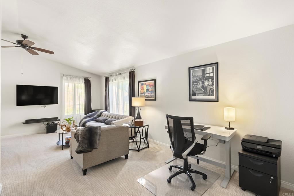 2225 Baxter Canyon Road Vista, CA 92081 - Photo 25 of 46 a view of a livingroom with workspace and a couch