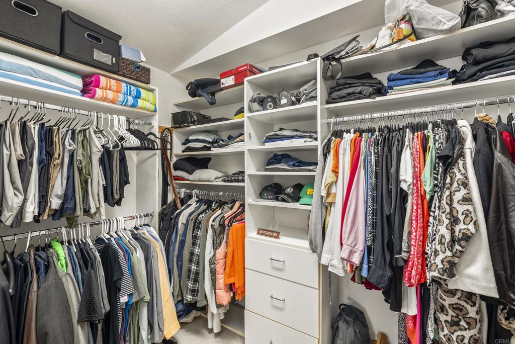 2225 Baxter Canyon Road Vista, CA 92081 - Photo 27 of 46 a view of walk in closet with clothes