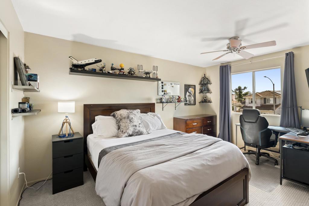 2225 Baxter Canyon Road Vista, CA 92081 - Photo 33 of 46 a bedroom with a bed and wooden floor