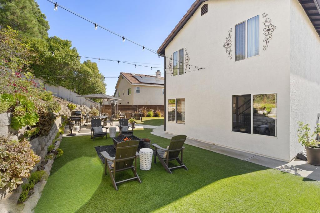 2225 Baxter Canyon Road Vista, CA 92081 - Photo 35 of 46 a view of a house with backyard sitting area and garden