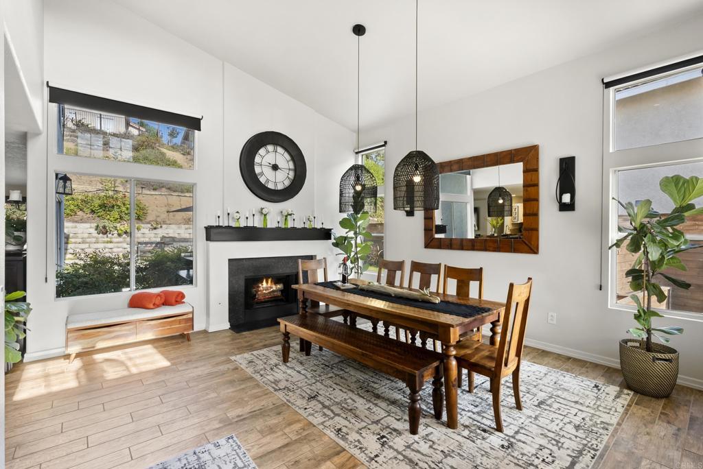 2225 Baxter Canyon Road Vista, CA 92081 - Photo 8 of 46 a living room with furniture a rug a fireplace and a large window