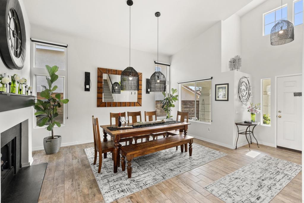 2225 Baxter Canyon Road Vista, CA 92081 - Photo 9 of 46 a living room with furniture and a wooden floor