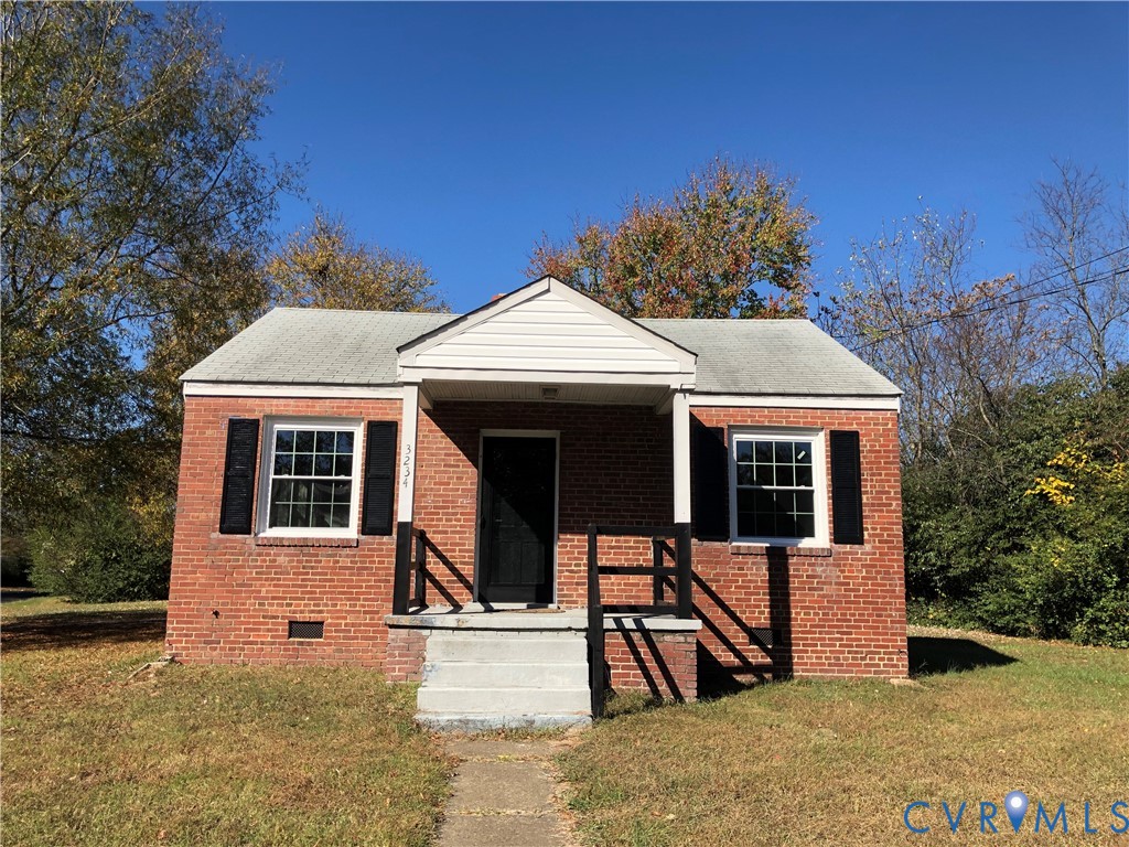 a view of a house with wooden fence