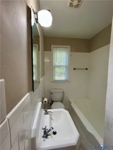 a bathroom with a sink and a bathtub