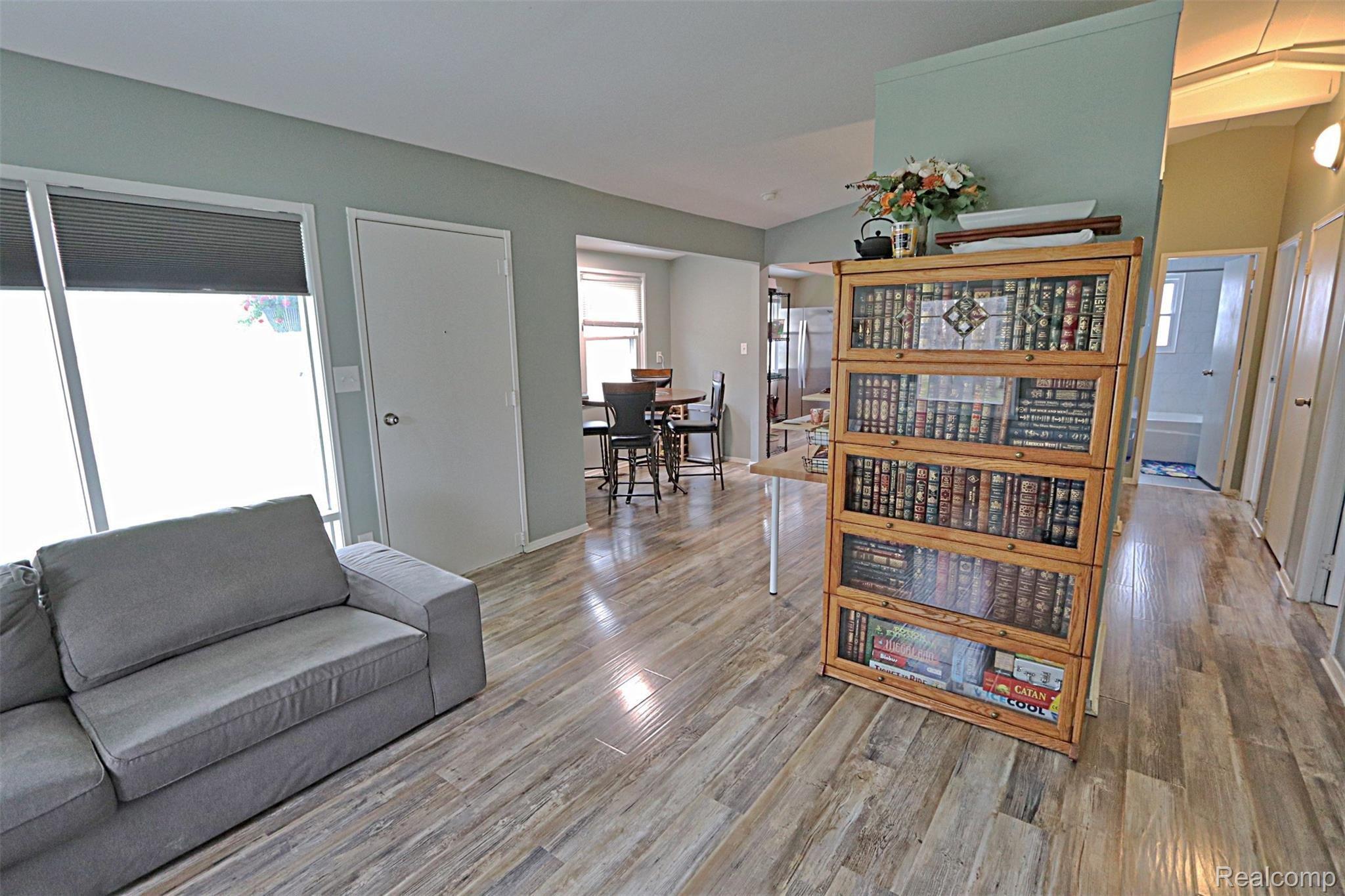 1215 Delta Road Walled Lake, MI 48390 - Photo 5 of 25 Family room is open to the dining space