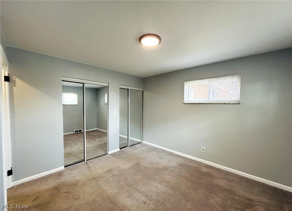424 Lee Road Follansbee, WV 26037 - Photo 7 of 12 Bedroom with multiple closets and carpet flooring
