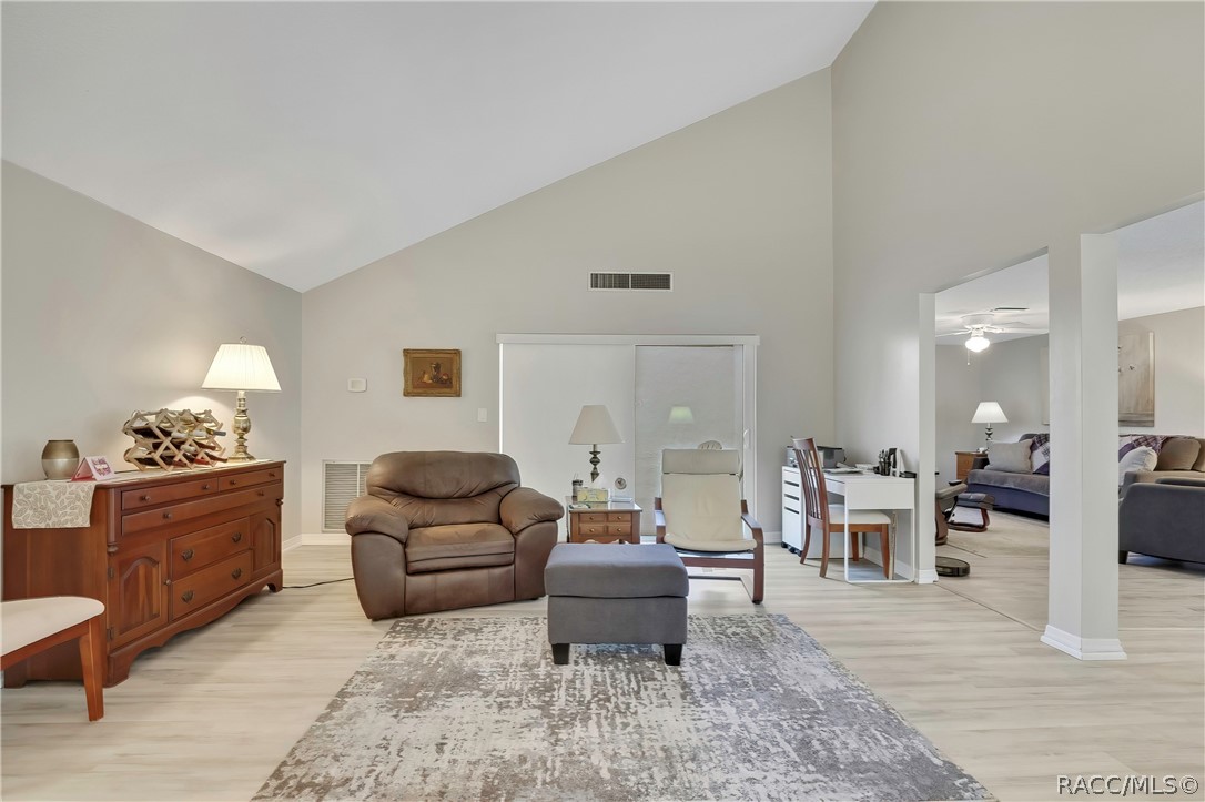 2 Quail Run Homosassa, FL 34446 - Photo 8 of 36 Vaulted ceiling and luxury vinyl plank flooring
