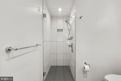 a bathroom with a shower and toilet