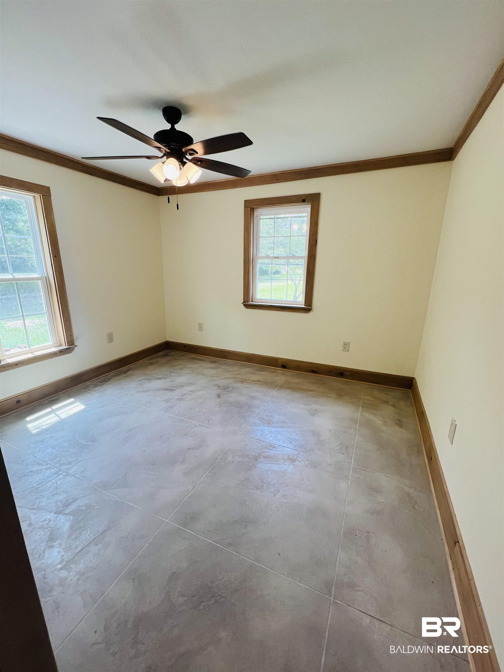 29685 Gardner Road Elberta, AL 36530 - Photo 9 of 16 Neutral-toned walls featuring wood-finish trim and two windows