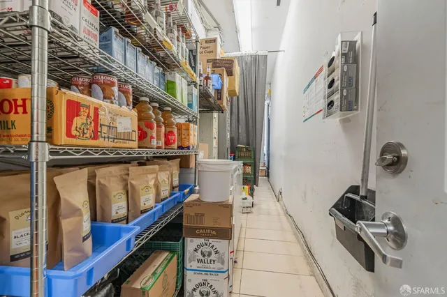 a utility room with multiple dryer and washer