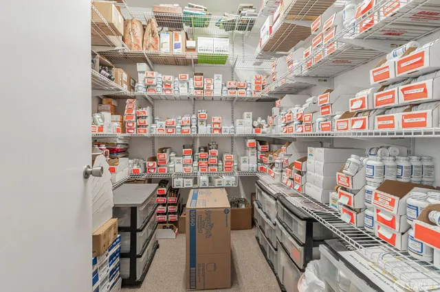 a bathroom with a toilet a sink and a mirror