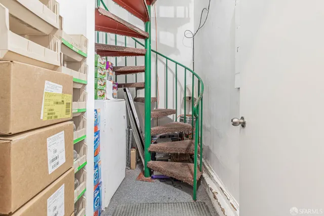 a utility room with multiple dryer and washer