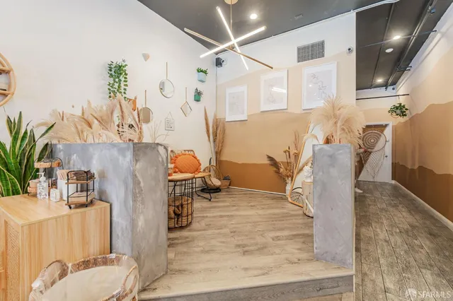 a dining room with furniture and wooden floor