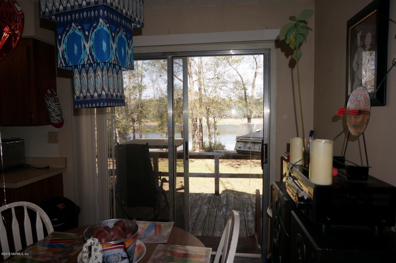 249 Swan Lake Road Melrose, FL 32666 - Photo 8 of 14 08) Dining Room Lake View