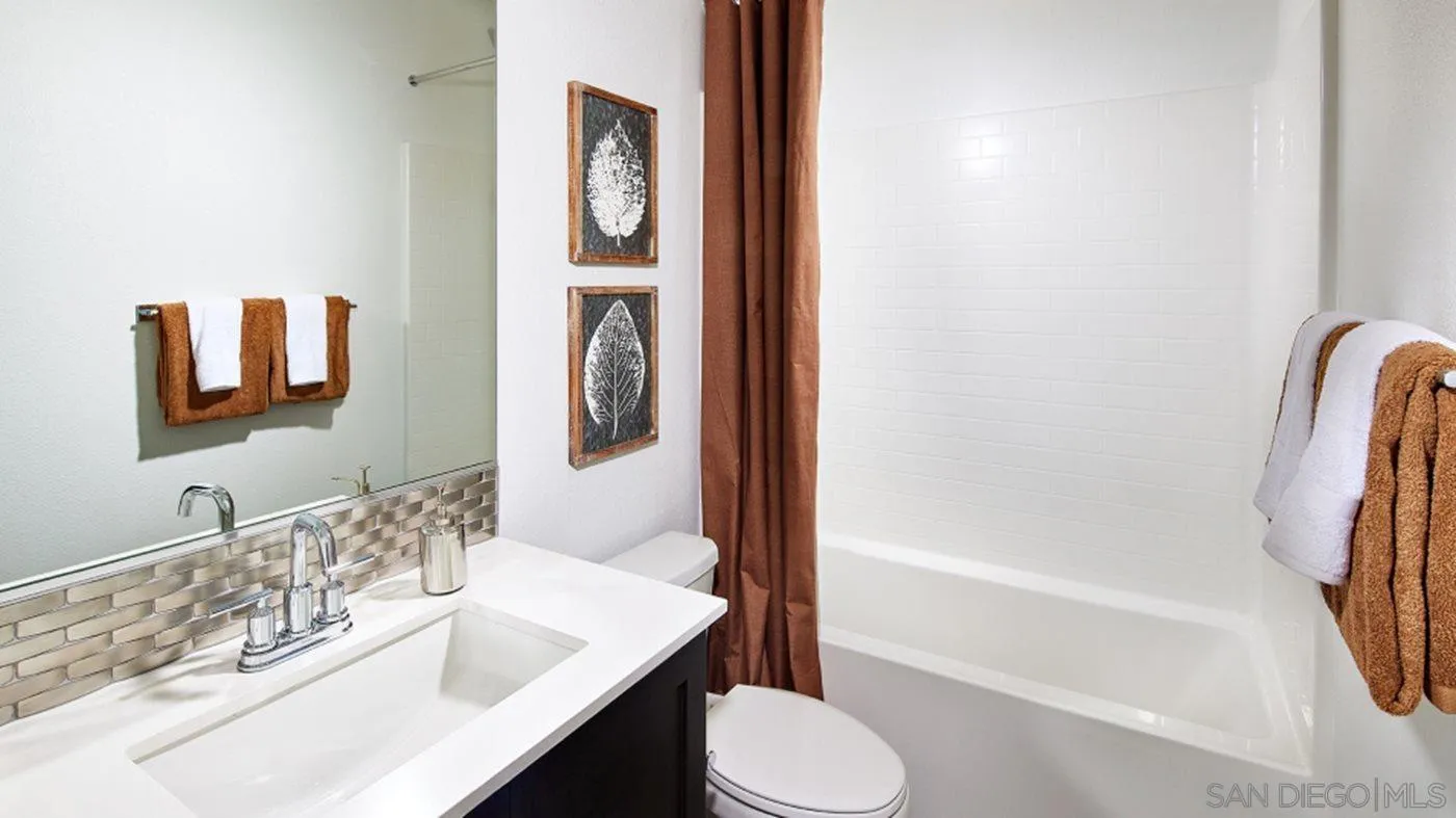 2193 Trevi Circle Chula Vista, CA 91913 - Photo 11 of 16 a bathroom with a sink a toilet and shower