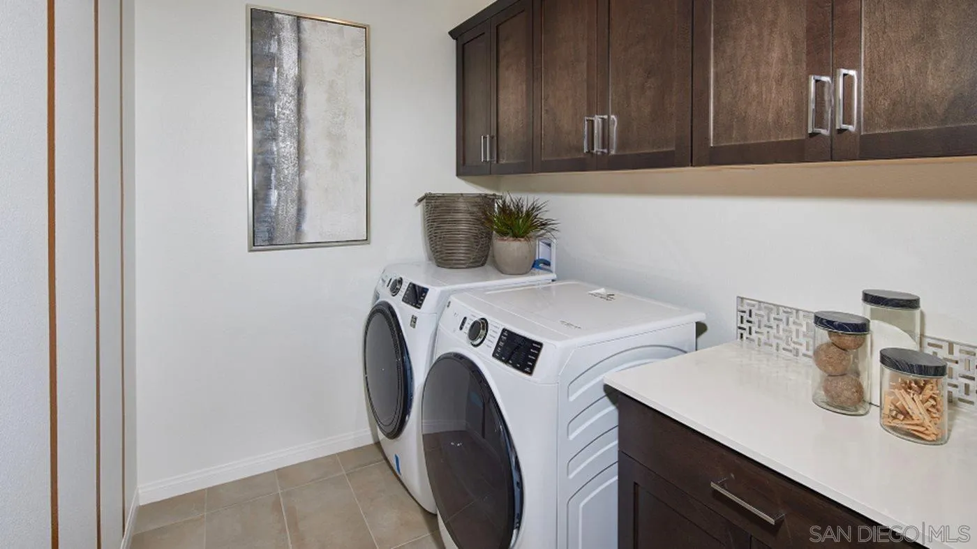 2193 Trevi Circle Chula Vista, CA 91913 - Photo 15 of 16 a utility room with sink dryer and washer