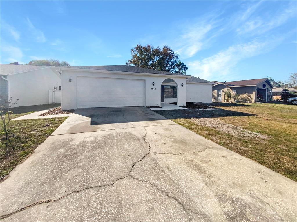 a house view with a backyard space