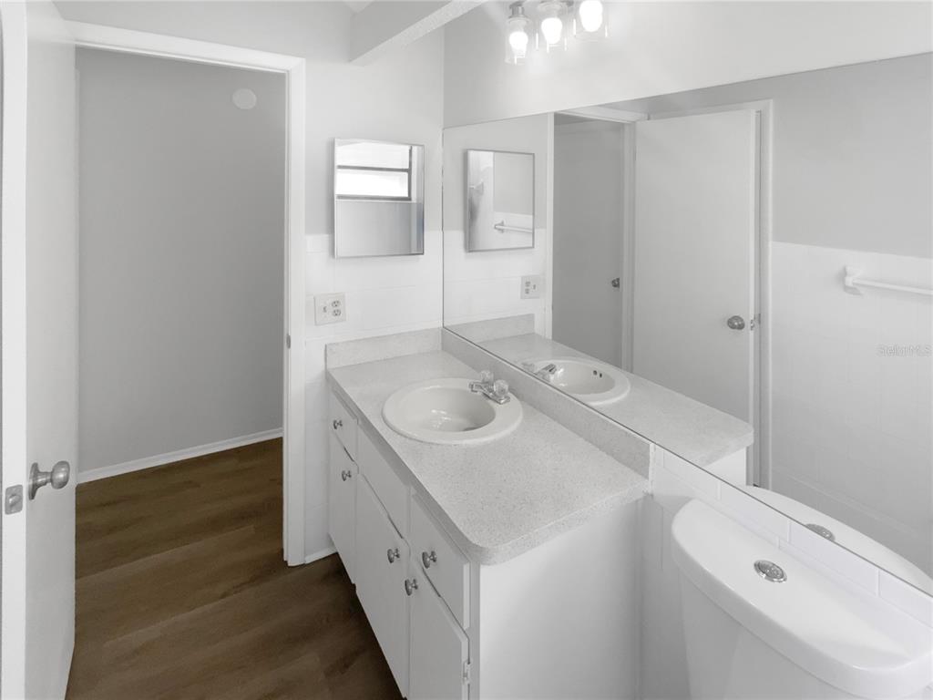 7846 Cayuga Drive New Port Richey, FL 34653 - Photo 13 of 32 a bathroom with a sink a vanity and a mirror