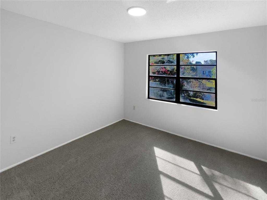 7846 Cayuga Drive New Port Richey, FL 34653 - Photo 14 of 32 an empty room with a window